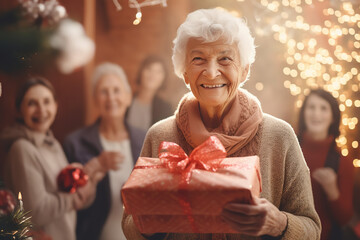 Poster -  An elderly woman is surrounded by family as she unwraps gifts, demonstrating the importance of family connections in later life