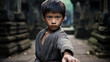 © kian - a young boy practices his martial arts forms in an ancient temple courtyard, the carved stone pillars bearing witness to generations of practitioners who have honed their skills