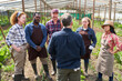 © Robert Kneschke - Multicultural male and female farmers discussing at farm