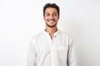 © Leon Waltz - medium shot portrait of a confident Mexican man in his 20s wearing a simple tunic against a white background