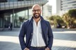 © Anne-Marie Albrecht - Portrait of a confident Israeli man in his 40s wearing a chic cardigan against a modern architectural background