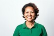 © Leon Waltz - portrait of a happy Filipino woman in her 50s wearing a sporty polo shirt against a white background