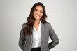 © Leon Waltz - portrait of a Filipino woman in her 30s wearing a sleek suit against a white background
