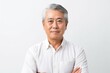 © Leon Waltz - portrait of a Japanese man in his 50s wearing a chic cardigan against a white background