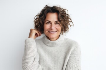 Poster - medium shot portrait of a confident Israeli woman in her 40s wearing a cozy sweater against a white background