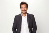 Fototapeta Do akwarium - portrait of a Mexican man in his 30s wearing a chic cardigan against a white background