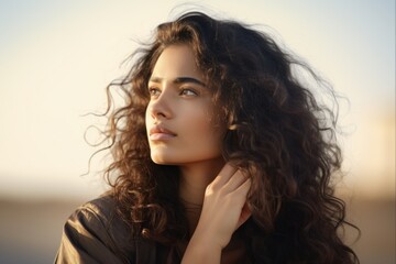 Far Away. Young Uruguayan Woman Gazing into the Distance over Isolated Background with Hand to Forehead