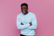 © Богдан Маліцький - cheerful african american man in blue sweater laughing on pink isolated background