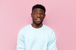 puzzled african american man in blue sweater in amazement on pink isolated background, confused and stunned man