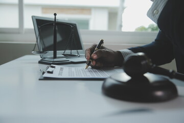 Business and lawyers discussing contract papers with brass scale on desk in office. Law, legal services, advice, justice and law concept picture with film grain effect