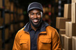 © Valeriia - Portrait of happy afro-american welcoming friendly man on street with boxes behind, storage shipping. Distribution ecommerce logistics employee in factory plant supply chain black wholesale supplier