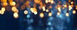holiday illumination and decoration concept, Christmas garland bokeh lights over dark blue background.