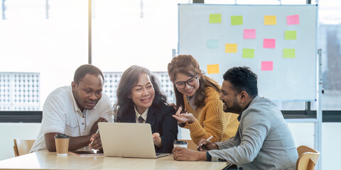 Wall Mural - diverse businesspeople gathered in the office having fun during brainstorming while discussing new i