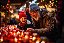 Grandfather And Grandson  Looking Christmas Decoration On A Christmas Market