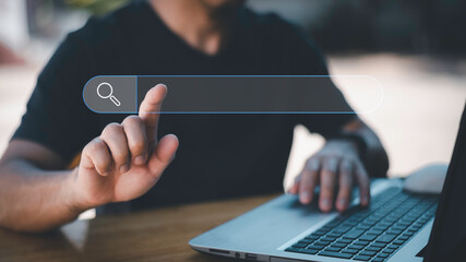 Data Search Technology Search Engine Optimization. man's hands are using a computer notebook to Searching for information. Using Search Console with your website.