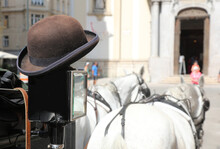 Bowler Hat Of The Coachman Who Takes Tourists Around The European City In His Carriage
