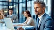 © visoot - Middle aged businessman in office, Positive confident professional, Confident good looking.