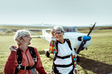 Senior lesbian couple getting ready to go skydiving together for their bucket list