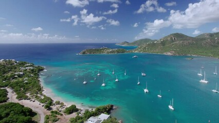 Wall Mural - The drone aerial view of Pigeon Point Beach and deep bay, Antigua Island.