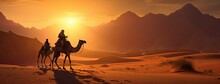 A Caravan Of Indian Camels, Led By Experienced Camel Drivers, Traversing The Mesmerizing Desert Sand Dunes At Sunset. The Warm Hues Of The Setting Sun Should Paint A Stunning Backdrop.