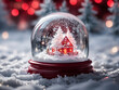 snow globe with red house christmas scene winter landscape and festive lights blur