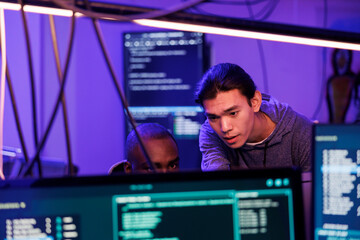 criminals hacking into computer system while planning cyberattack and discussing phishing technique.
