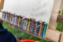 Carpet Weaving Using Traditional Techniques On A Loom. , Close-up Of Weaving And Handmade Carpet Production.