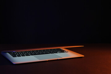 Modern laptop on black background