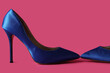 Leinwandbild Motiv Stylish blue high heels on pink background