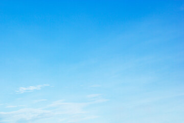 Wall Mural - fantastic soft white clouds against blue sky and copy space horizontal shape