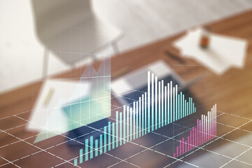 Multi exposure of abstract creative financial graph and modern desktop with computer on background, forex and investment concept