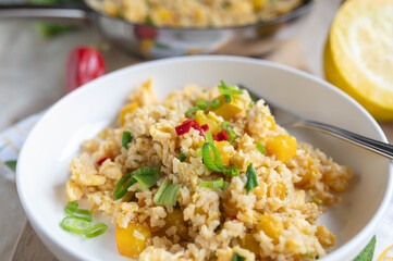 Wall Mural - Vegetable rice with yellow zucchini, chili peppers and chives. Cooked with brown rice. Healthy gluten free side dish