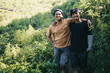 Young Asian hiker men standing together and smiling at camera outdoor