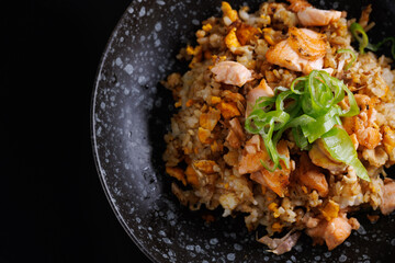 Wall Mural - Japanese fried rice yakimeshi isolated in black background