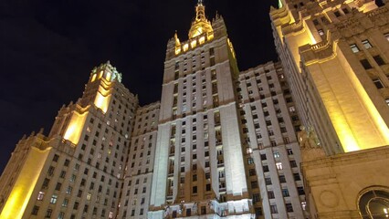 Wall Mural - Timelapse Hyperlapse of Stalin's Famous Skyscraper on Kudrinskaya Square at Winter Night, Moscow, Russia. Illuminated Cityscape and Landmark Architecture