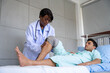 © SKW - Female doctor and male patient Physical therapy is being done at the hospital.