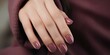 © BajimBa - Close-up of a woman's hand with nail polish, manicure.