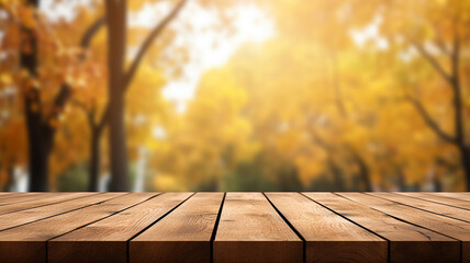 Wall Mural - The empty wooden table top with blur background of autumn.