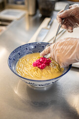 Wall Mural - Chef making japanese ramen noodle soup in restaurant