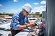 A man wearing a hard hat is diligently working on repairing an air conditioner. This image can be used to depict maintenance, repair, or construction work related to air conditioning systems.
