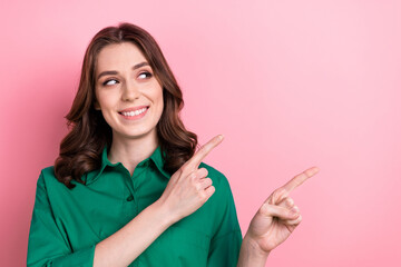 Sticker - Photo of dreamy pretty lady wear green shirt looking pointing two fingers empty space isolated pink color background