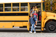 © Prostock-studio - Transportation Concept. Group of happy children getting out the yellow school bus