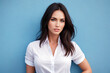 © Anatoly Tiplyashin - Beautiful woman brunette in white shirt beauty  portrait on blue background.