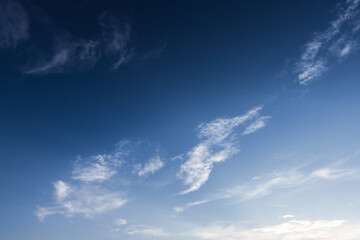 Wall Mural - deep blue sky with small white clouds. natural background