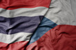 big waving national colorful flag of thailand and national flag of czech republic .