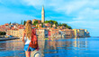 Young female tourist traveling in Europe- Croatia,  rovinj city and adriatic sea- Istria
