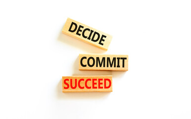 Wall Mural - Decide commit succeed symbol. Concept word Decide Commit Succeed on beautiful wooden block. Beautiful white table white background. Business decide commit succeed concept. Copy space.