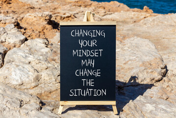 Wall Mural - Changing mindset symbol. Concept words Changing your mindset may change the situation on beautiful black blackboard on a beautiful stone background. Business motivational Changing mindset concept.