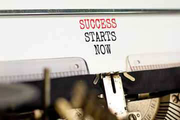 Wall Mural - Success starts now symbol. Concept word Success starts now typed on beautiful retro old typewriter. Beautiful white paper background. Business motivational success starts now concept. Copy space.