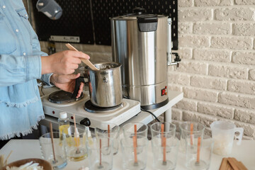 Wall Mural - Master makes candles in the workshop